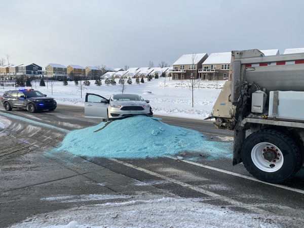 Car Trapped In Pile After Salt Truck Spill