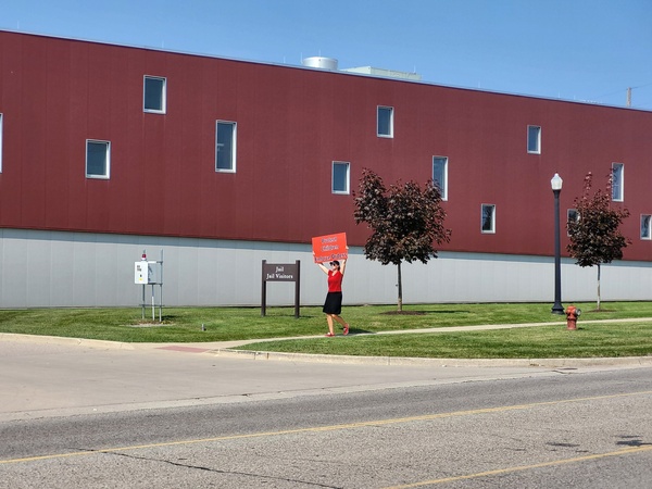 Parent Demonstrating For Changes In Local Court System